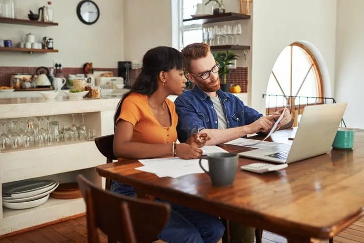 couple reviewing bills on laptop.width .jpg