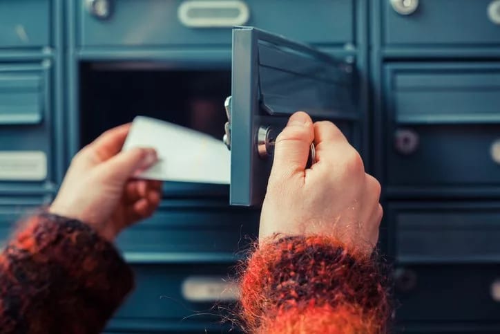 hands opening mailbox VVYGwqo.width .jpg