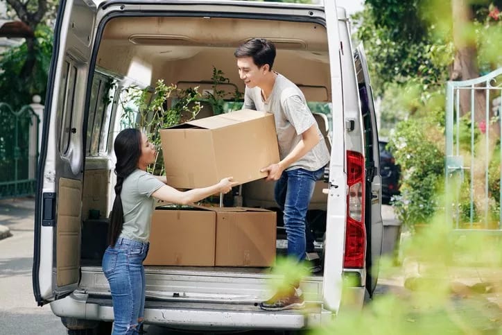 couple unloading boxes from moving van.width pqgddQi.jpg