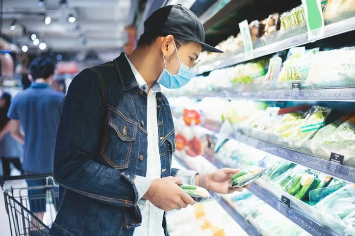 man in mask grocery shopping.width .jpg