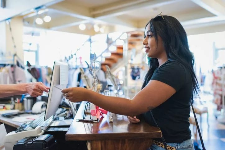 woman paying with credit card lPGSlIQ GwyEw.width .jpg