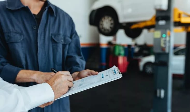 car mechanic signing bill UzgJNlX.width .jpg