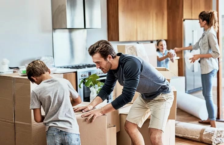 parents and kids packing moving boxes.width .jpg