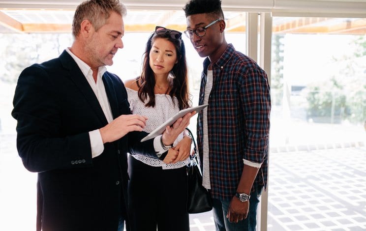 couple with realtor in house.width