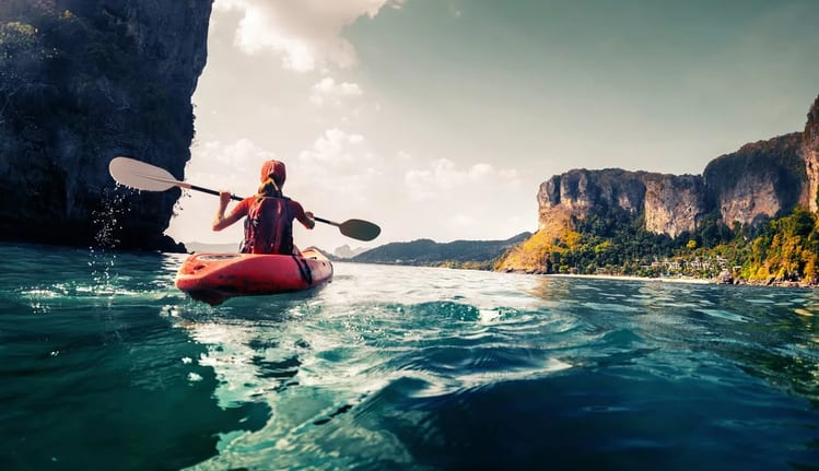 woman in kayak on ocean PZUXh.width .jpg