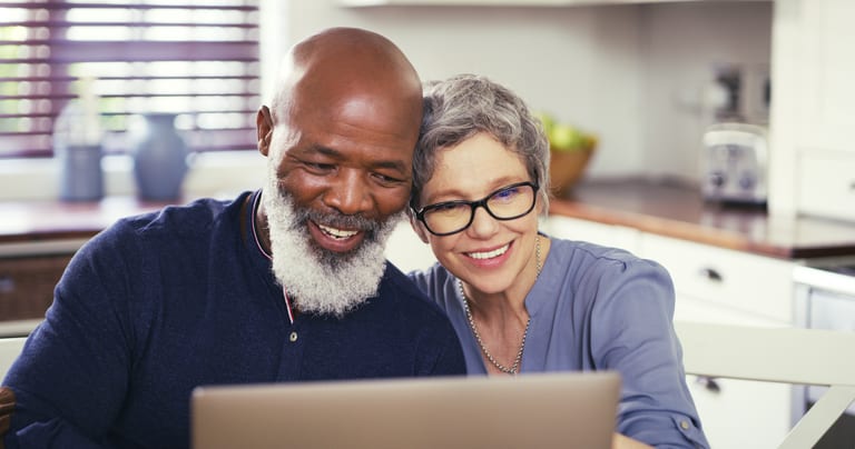 older couple at laptop smiling gettyimages .jpg