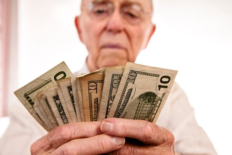 A person fanning out cash