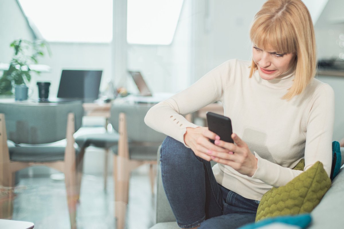 Woman uncomfortable by what shes reading on h.width InPJRqv