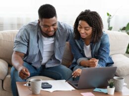 Couple using laptop and calculator together s.width agvB.jpg