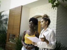 woman with realtor outside house.width .jpg