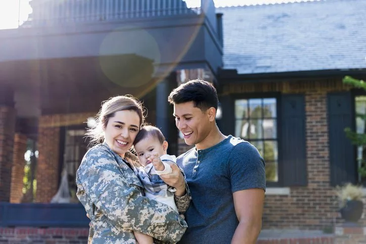 female veteran with baby and husband JxapTO.width .jpg