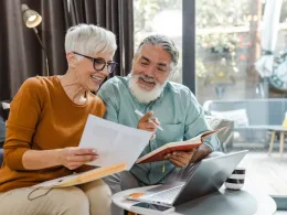 excited couple looking at document together.jpg